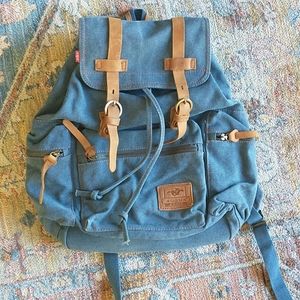 Brand new denim and genuine leather backpack.